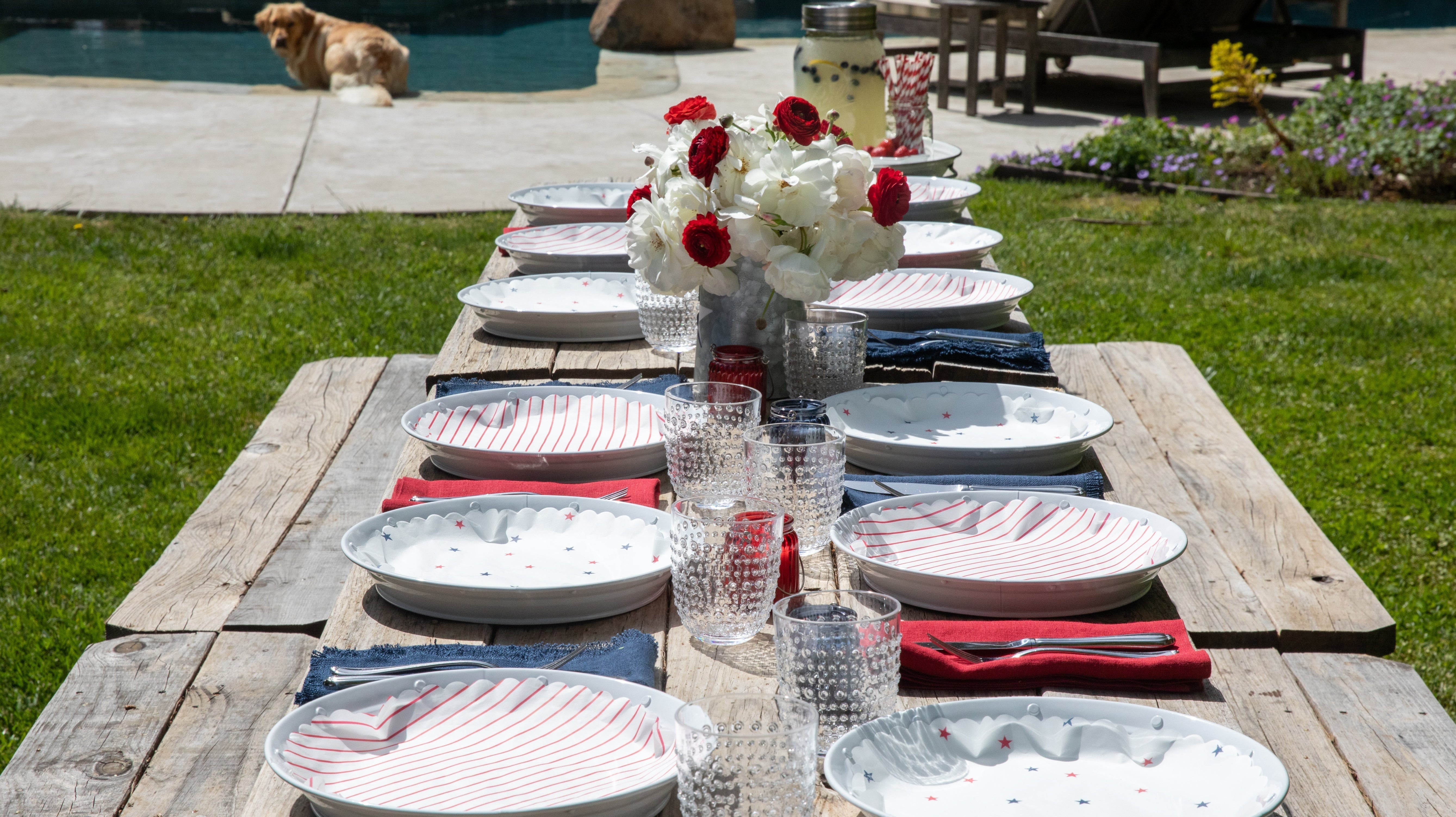 White Metal plates lined with red striped plate liners and Oh Say Can You See navy and red starred plate liners